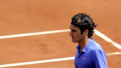 Roger Federer of Switzerland reacts after winning his third round match at the French Open on Friday. Yoan Valat / EPA / May 29, 2015