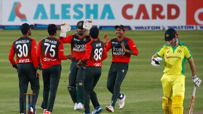 Bangladesh's Shakib Al Hasan celebrates with his teammates after taking the wicket of Australia's Moises Henriques.