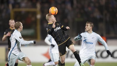 Dundalk's Daryl Horgan, centre, struggles for a ball with Zenit's Aleksandr Anyukov, left, and Aleksandr Kokorin, right, during the Europa League Group D match in St Petersburg, Russia, Thursday, November 3, 2016. Dmitri Lovetsky / AP Photo