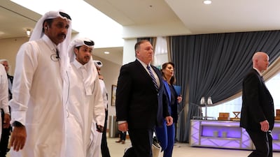 US Secretary of State Mike Pompeo walks ahead of the signing of an agreement between members of Afghanistan's Taliban delegation and the US government in Doha, Qatar. Reuters