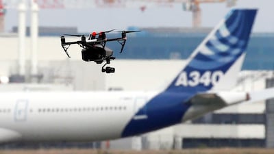 A drone flies near an Airbus A340 aircraft in Colomiers near Toulouse, France. Reuters