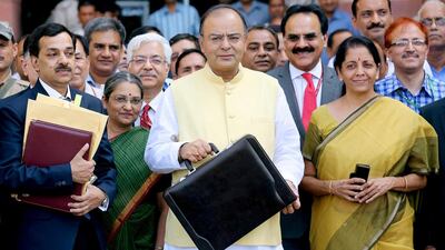 Indian finance minister Arun Jaitley, centre, and minister of state for finance corporate affairs Nirmala Sitharaman, right. Money Sharma / EPA