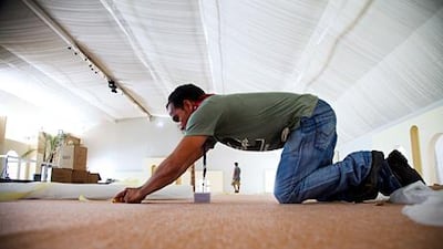 Almost 90 employees at Emirates Palace are reassigned to staff the Ramadan tent, which will welcome more than 800 guests every evening during the period. Above, the hotel's Ramadan tent in the process of being constructed. Lee Hoagland / The National
