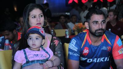 Mohammed Shami, right. with his family in 2017. Shami is being investigated by police over claims of infidelity and domestic violence by his wife. Shivam Saxena / Getty Images