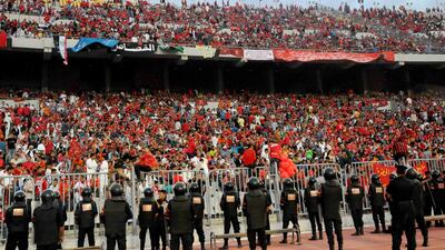 FILE - In this Sunday, Nov. 4, 2012 file photo, Egyptian riot police stand guard at the Borg El-Arab Stadium stadium near Alexandria, Egypt, before Egypt's Al-Ahly club takes on Tunisia's Esperance for a match in the first leg of the African Champions League final near Alexandria, Egypt. Two international football matches, including a World Cup playoff, are set to take place in Egypt’s turbulent capital, putting security there to the test after violent street protests and bloody security crackdowns followed a military coup. Egypt's home match against Ghana deciding which African team will go to Brazil next year will be Nov. 19, 2013 in a military-owned stadium in the capital. In a test run for security forces, Cairo's Al-Ahly club will host South Africa's Orlando Pirates in the second leg of their African Champions League final this weekend in the same stadium. (AP Photo/Mohammed Asad, File) *** Local Caption *** Mideast Egypt Fan Dilemma.JPEG-0f039.jpg