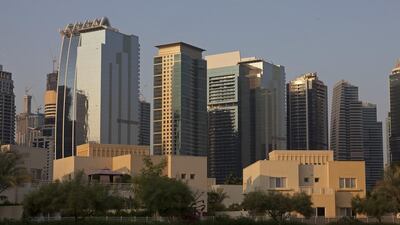 The Dubai skyline is a background for villas in the Meadows in Dubai. Peter Cooper thinks house prices and interest rates have not ever gone up at the same time. Jeff Topping / The National