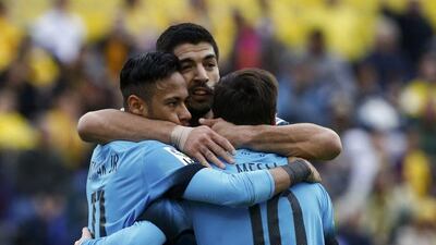 Barcelona stars Luis Suarez, centre, Neymar and Lionel Messi celebrate a goal in a La Liga match in February. Juan Medina / Reuters