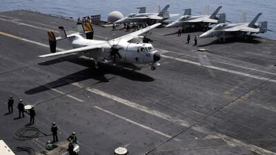 An aircraft lands on the USS George HW Bush in the Arabian Gulf on August 13, 2014. The aircraft carrier has served as a launching pad for airstrikes on Islamic State fighters who are threatening to kill thousands of Iraqis from minority communities in the north of the country. Hamad I Mohammed / Reuters