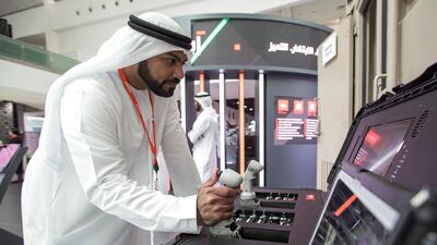 Ahmed Al Shehhi domonstrates the EARTH, remote control container system. Victor Besa / The National