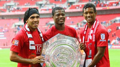 Nani, Patrice Evra and Carlos Tevez of Manchester United celebrate with the 2008 Community Shield. Getty Images