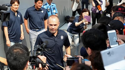 Spanish football player Andres Iniesta is surrounded by Japanese fans upon his arrival at Kansai International Airport in Izumisano, Osaka, Japan, on July 18, 2018. Jiji Press / EPA