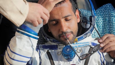 Hazza Al Mansouri reacts shortly after landing. Reuters