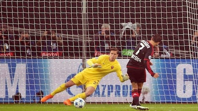 Javier Hernandez of Bayer Leverkusen scores his team's opening from a spot kick on Tuesday against AS Roma in the Champions League. Federico Gambarini / EPA