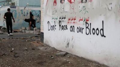 Bahraini youths set up cement block roadblocks during clashes with riot police to slow police vehicles moving through the village of Diraz, Bahrain, on Thursday. Hasan Jamali / AP Photo