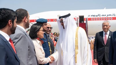 Sheikh Mohamed bin Zayed is welcomed by Chinese officials upon landing in Beijing on Sunday. Rashed Al Mansoori / Ministry of Presidential Affairs