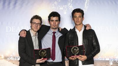 From left, the US composer Nicholas Britell, the US director Damien Chazelle and the US actor Miles Teller with the Grand Prize for Whiplash at the 40th annual Deauville American Film Festival in Deauville, France. Etienne Laurent / EPA