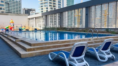 The facilities include a swimming pool, restaurants and a salon in the building