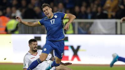 Montenegro's Aleksandar Scekic, left, with Kosovo's Benjamin Kololli during their Euro 2020 Group A qualifying match in Pristina, Kosovo. EPA