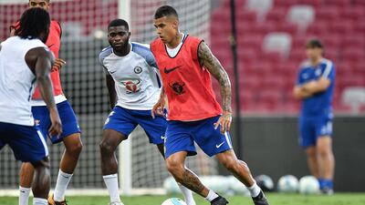 Chelsea defender Kenedy runs with the ball during a training session at National Stadium on July 24, 2017 in Singapore. Thananuwat Srirasant / Getty Images