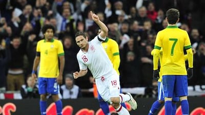 Frank Lampard celebrates after scoring for England against Brazil in the friendly at Wembley Stadium.