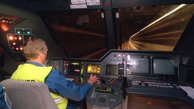 A machinist drives a trans-channel shuttle during a technical trial run on May 6, 1994. Up to 400 trains pass through the tunnel each day, carrying an average of 50,000 passengers, 6,000 cars, 180 coaches and 54,000 tonnes of freight. Jacques Demarthon / AFP