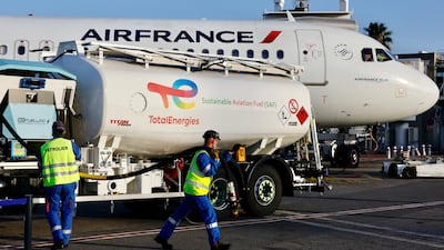 An Air France aircraft, operated with sustainable aviation fuel produced by TotalEnergies, is refuelled before its first flight from Nice to Paris in October. Reuters