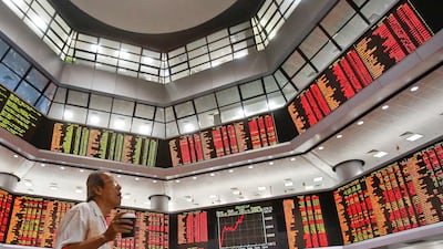 Asian equity markets are tense as US inflation looms. Sadiq Asyraf/AP