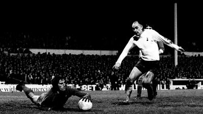 File photo dated 06-01-1972 - Liverpool goalkeeper Ray Clemence dives at the feet of Tottenham Hotspur's Alan Gilzean. PA Photo