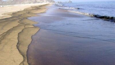 Oil washes up on the beach in Fujairah. Courtesy: Fujairah Rotana Resort & Spa