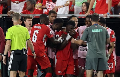 Switzerland's Breel Embolo reacts after being sent off. AFP