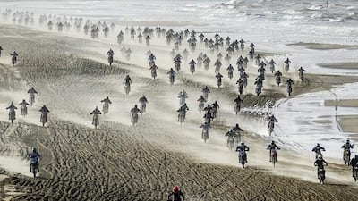 About 1,500 motocross racers took to the sands of The Hague beach in the Netherlands, on November 28, 2015, in hopes of qualifying for the Red Bull Knock Out final. The event is the largest and toughest motocross beach race in the world. Amateur and pro motocross riders not only compete against each other, but also battle the sea and sand. Remko De Waal / EPA