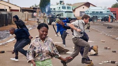 Ryan Phillippe runs for cover as riot police open fire on the set of the Bang Bang Club, Thokoza 2009. Photo Greg Marinovich
