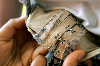The label bearing Judy Garland's name on the original dress worn by the actress in 1939 film 'The Wizard of Oz'. AFP