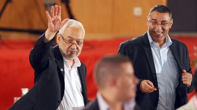 Rached Ghannouchi waves as he arrives for a meeting as part of the dialogue between Tunisia's ruling Islamists and the opposition aimed at ending a two-month crisis last year at the Palais des Congres in Tunis. During his recent trip to Washington, Mr Ghannouchi was, for no justifiable reason, given the lion’s share of credit for Tunisia’s relative stability. Fethi Belaid / AFP
