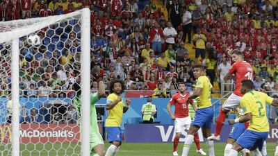 Switzerland's Steven Zuber, second from right, scores his side's equaliser against Brazil. Themba Hadebe / AP Photo