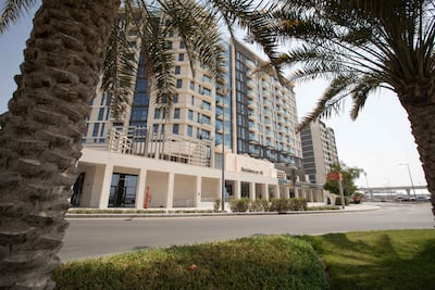 Graham Halton and his partner enjoy the clean environment and facilities at Expo Village Residences. Leslie Pableo / The National