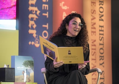 Festival director Ahlam Bolooki reading the Arabic version of 'My Little World' at the 2021 Emirates Airline Festival of Literature at InterContinental Dubai - Festival City. Leslie Pableo / The National