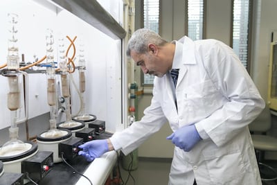 Emad El Najjar, stands at the distilling station at UAE University lab, where a research team is investigating the use of date pits to produce biodiesel. Reem Mohammed / The National