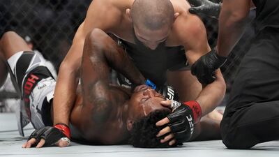 Khamzat Chimaev embraces Kevin Holland after Chimaev won their 180-pound catchweight bout at UFC 279. AP