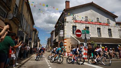 UAE Team Emirates' Adam Yates, Astana Qazaqstan Team's Davide Ballerini and Alpecin - Deceuninck's Mathieu Van Der Poel in action. AFP