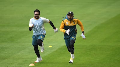 Imam-ul-Haq and Babar Azam of Pakistan warm up during training ahead of the first Test at Emirates Old Trafford in Manchester. Getty