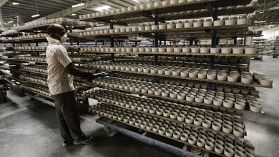 Workers at the production line of the porcelain section at RAK Ceramics. Jaime Puebla / The National
