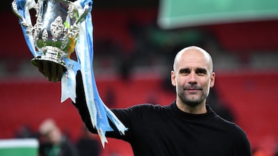 Pep Guardiola celebrates after winning the League Cup in 2020. Getty