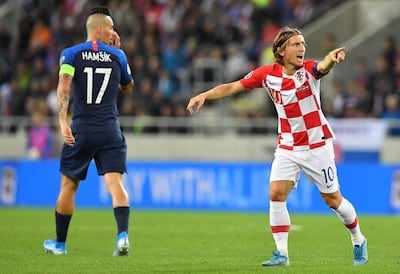Croatia captain Luka Modric reacts next to Slovakia captain Marek Hamsik. AFP