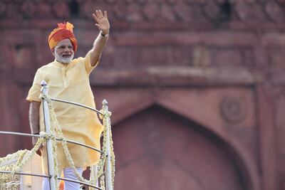 Indian Prime Minister Narendra Modi waves from the Red Fort in New Delhi after his Independece Day speech on August 15, 2017. Prakash Singh / AFP