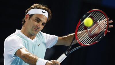 epa05069142 Roger Federer of OBI UAE Royals in action against Ivo Karlovic of Philippine Mavericks during their match of the International Premier Tennis League (IPTL) at Dubai Duty Free Tennis Stadium in Dubai, United Arab Emirates on 14 December 2015. EPA/ALI HAIDER