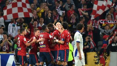 Lille Divock Origi is congratulated by his teammates after scoring the eventual winning goal against Bastia on Saturday in Ligue 1. Philippe Huguen / AFP / September 27, 2014