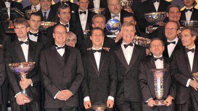 Max Mosley is seen with Prince Albert of Monaco, World Rally Champion Marcus Gronholm, and German Formula One driver Michael Schumacher during an FIA prize award ceremony in Monte Carlo, Monaco, in 2002. Getty Images