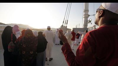 Muslims pray after casting seven stones at a pillar that symbolises Satan during the annual Haj pilgrimage in Saudi Arabia. Amr Abdallah Dalsh / Reuters