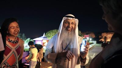 Mr Al Hariri explains the Perseid meteor shower spectacle to hotel guests. Pawan Singh / The National